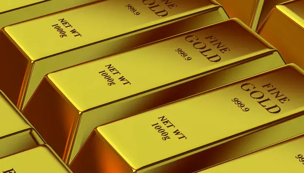 Prețul aurului pierde 3,8% într-o săptămână. Dolarul puternic și Fed-ul dur lovesc în valoarea metalului galben